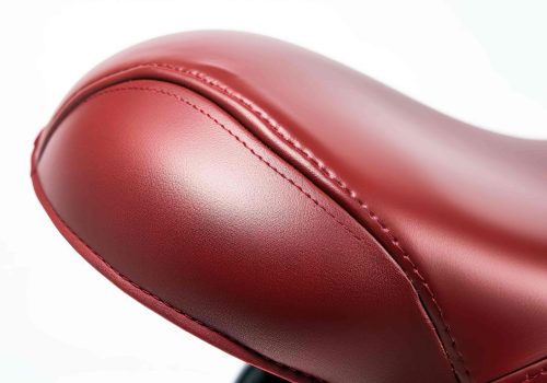 close-up-red-motorcycle-seat-white-clear-surface-png-transparent-background-min