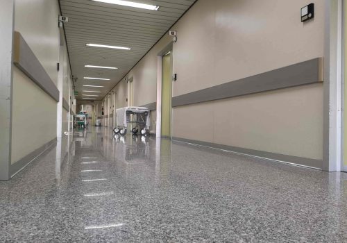 hospital-corridor-with-empty-stretcher-min
